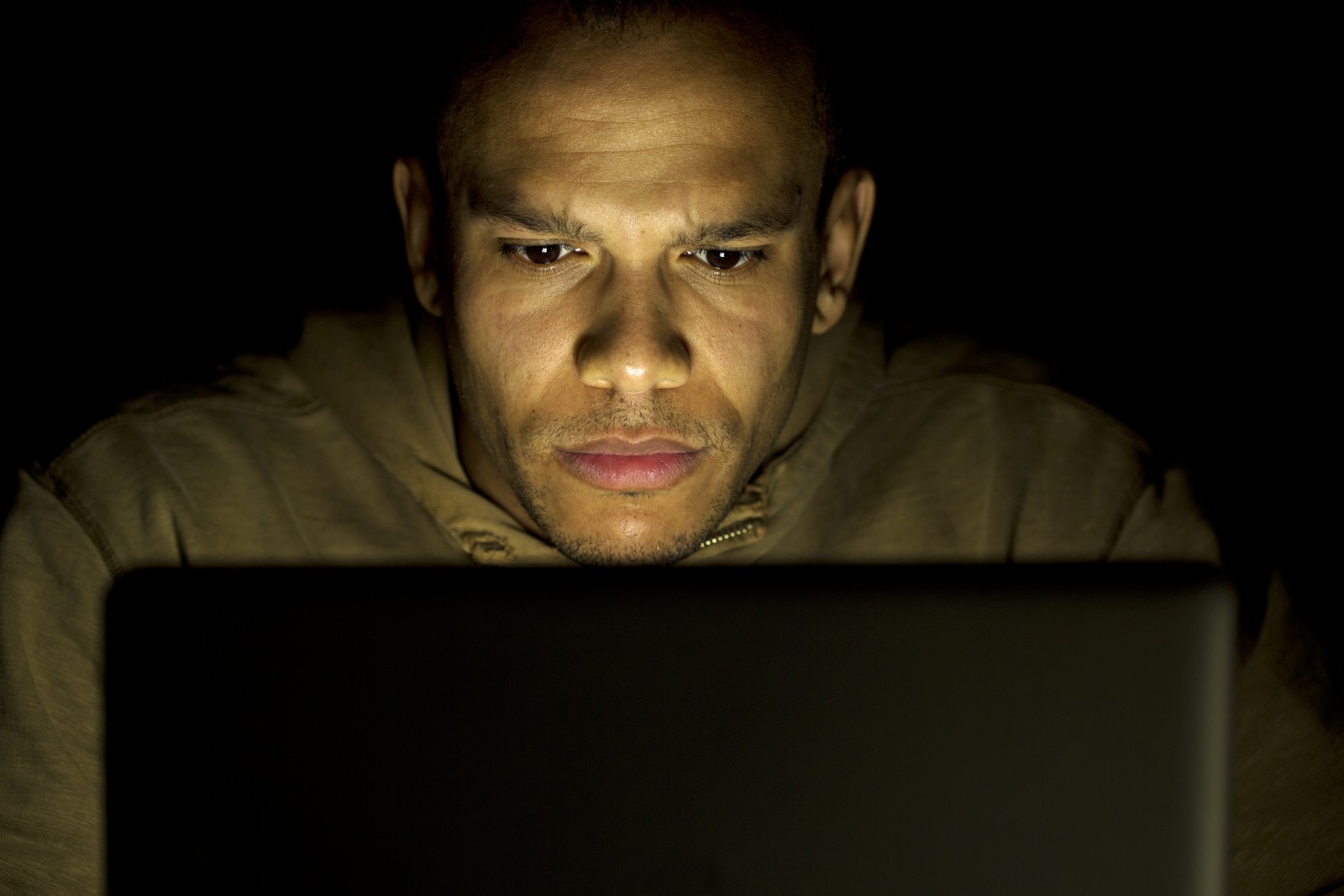 man on laptop late at night